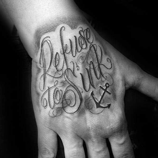 Elegant hand tattoo featuring the phrase "Refuse to Sink" in decorative script with a small anchor design