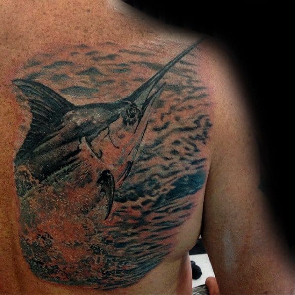 Male With Cool Marlin Tattoo Design On Shoulder Blade