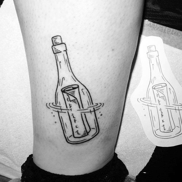 Tattoo of a Message in a Bottle on skin, beside a similar sketch