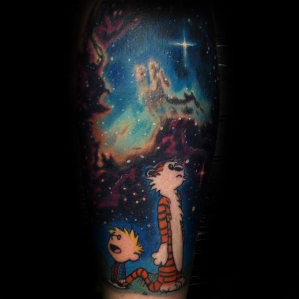 Tattoo of two cartoon characters gazing at a colorful, starry nebula night sky with a bright star
