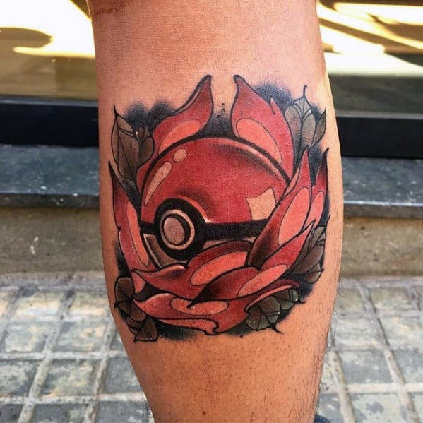 Bold Pokeball tattoo wrapped in red petals and dark leaves, combining floral elegance with a strong, modern Pokémon aesthetic.