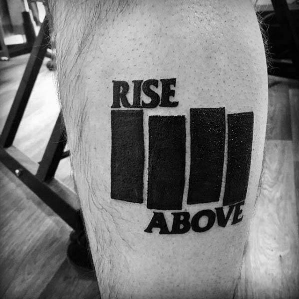 Black Flag bars tattoo with bold text “RISE ABOVE” above and below, inspired by the band’s anthem of defiance and empowerment.