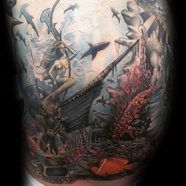Detailed underwater tattoo featuring a mermaid on a sunken ship, deep-sea diver, treasure chest, sharks, coral, and giant octopus tentacles.