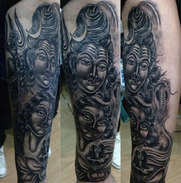 Dark-toned sleeve tattoo featuring Lord Shiva and Goddess Parvati with serene expressions, a cobra, trident, and Shivling, all intricately shaded.
