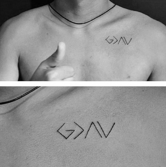Minimalist chest tattoo featuring the "God is greater than the highs and lows" symbol in sleek black linework