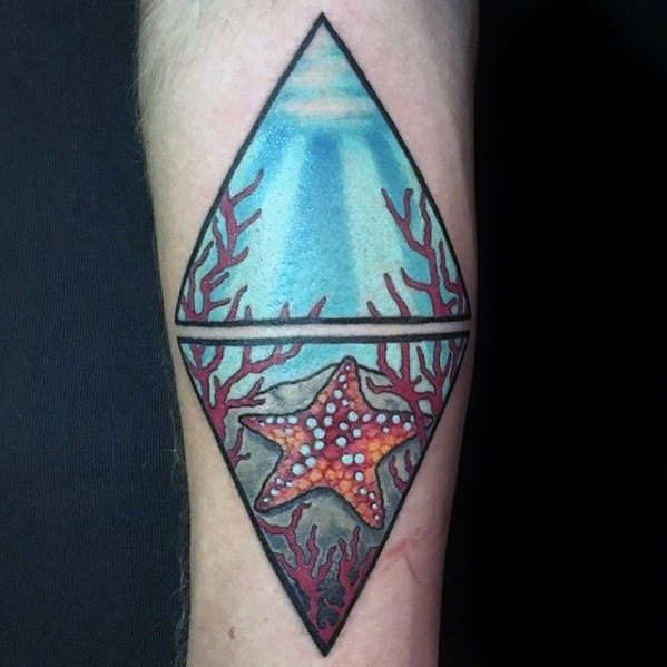 Geometric underwater tattoo featuring a red starfish and coral inside a diamond shape, split to show both sea surface and ocean floor.
