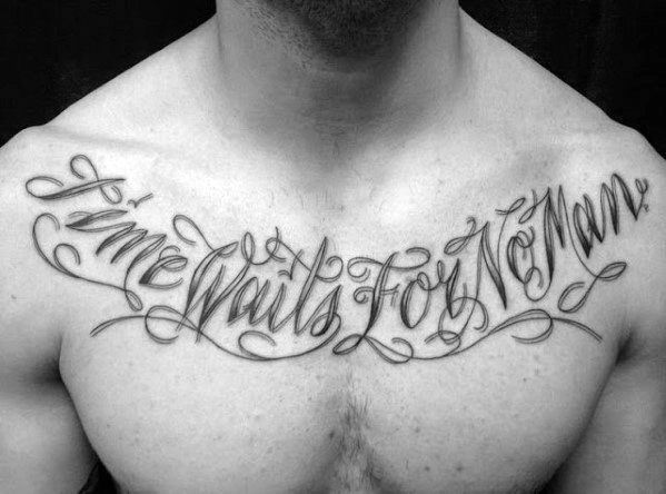 Elegant chest tattoo in flowing cursive script that reads Time Waits for No Man across the collarbone area.