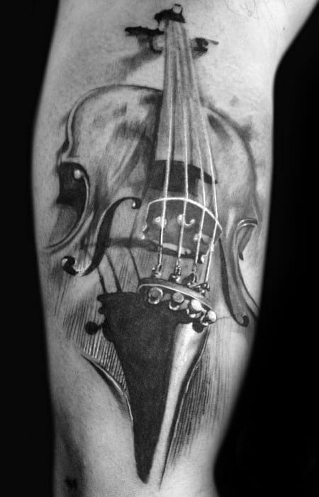 Realistic black and gray tattoo of a detailed violin on the forearm, featuring fine shading and depth for a lifelike, elegant appearance.