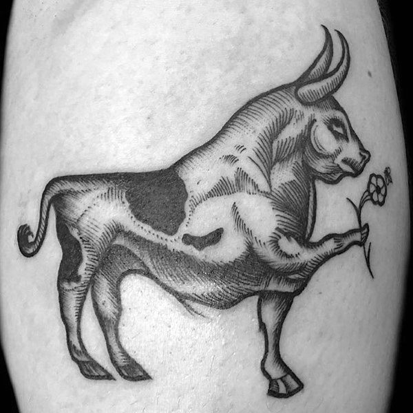 Whimsical blackwork tattoo of a muscular bull holding a flower, blending strength and gentleness with detailed shading.