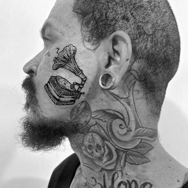 Male With Face Tattoo Of Gramophone