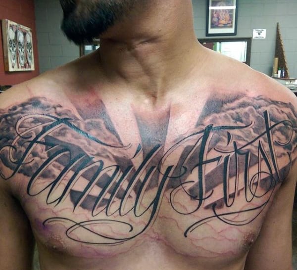 Male With Family First Wordings Tattoo On Chest