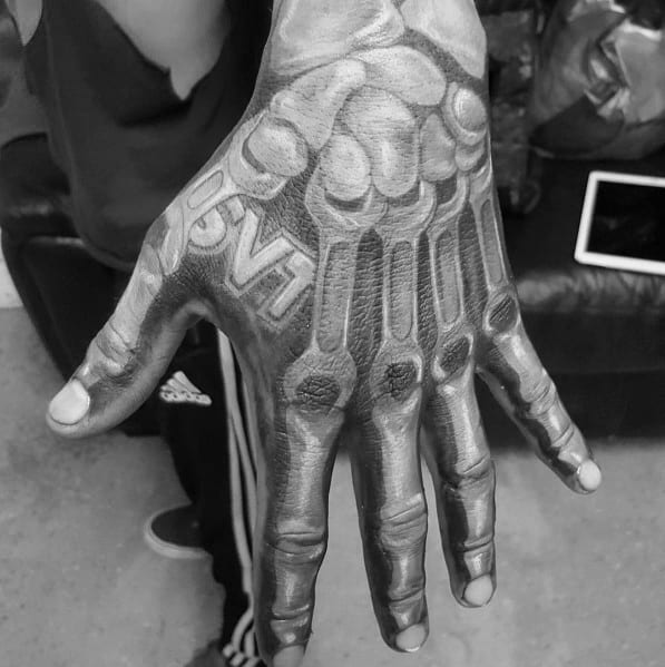 Realistic Ford SVT skeletal hand tattoo, featuring intricate shading and a 3D effect to create a bone-like structure with bold lettering.