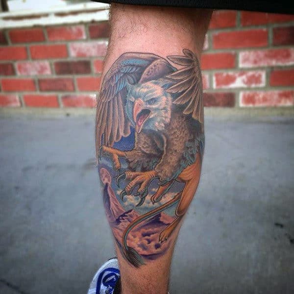 Male With Griffin Leg Calf Tattoo