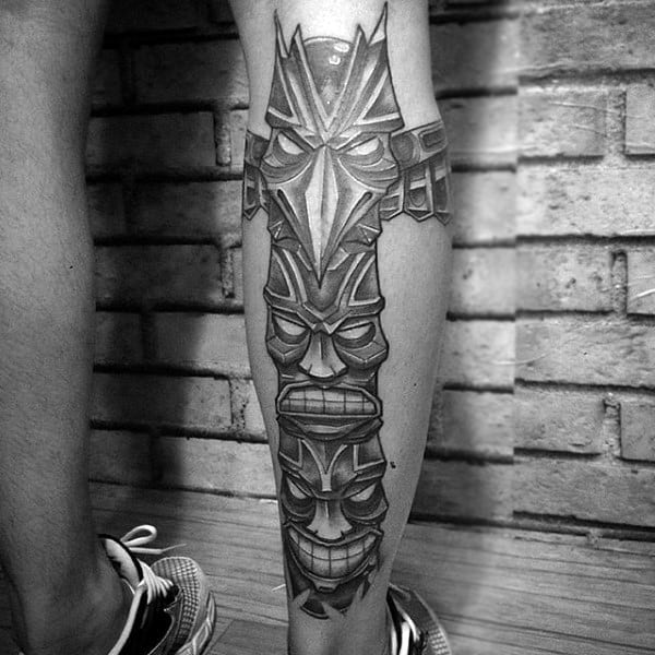 Male With Grining Totem Pole Traditional Calf Tattoo