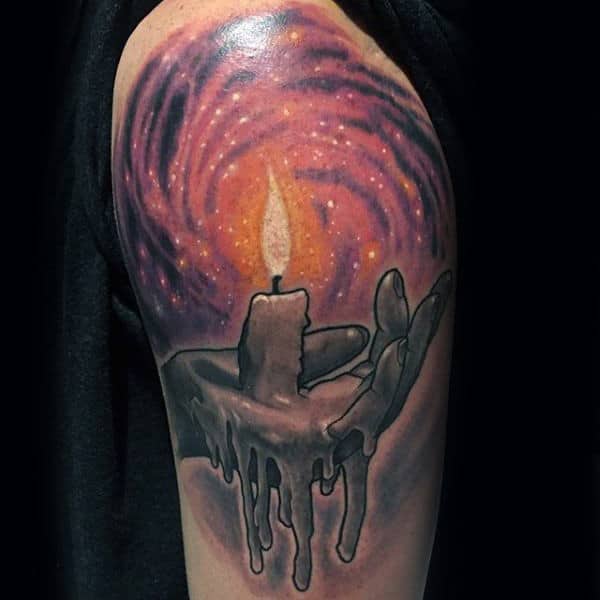 Male With Hand Holding Candle Artistic Outerspace Design On Arm