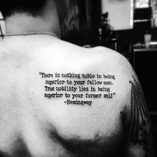 Male With Hemingway Typewriter Font Shoulder Tattoo