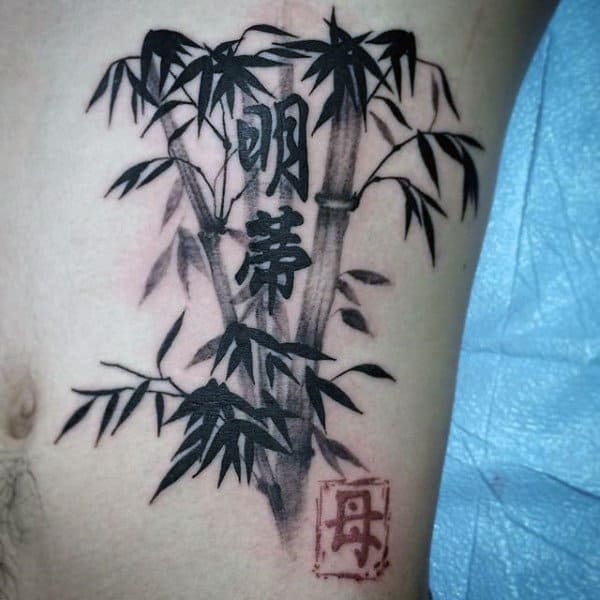Male With Japanese Symbol Bamboo Tattoos