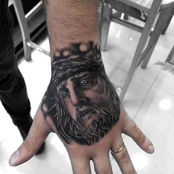 Male With Jesus Christ Religious Hand Tattoo
