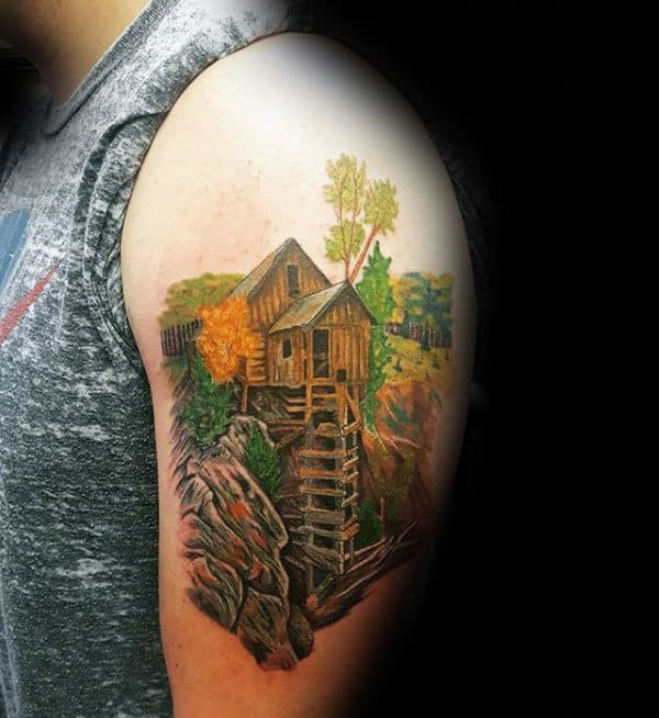 Male With Landscape Cabin Tattoo On Upper Arm