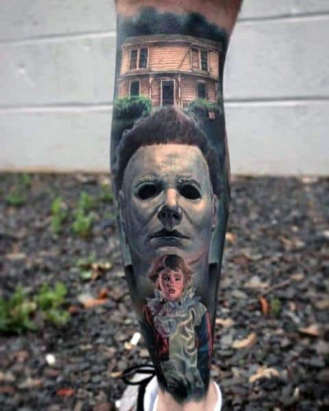 Michael Myers tattoo featuring his eerie mask, the infamous house, and a young clown-costumed figure for a haunting horror design.