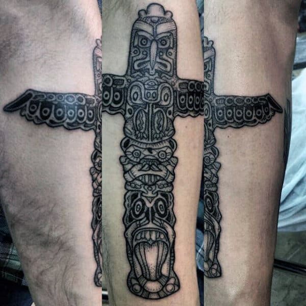 Male With Line Work Evil Totem Pole Forearm Tattoo