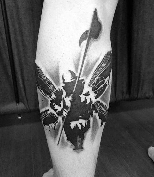 Bold black ink tattoo of Linkin Park's Hybrid Theory soldier, featuring a striking stencil-style design on the calf.