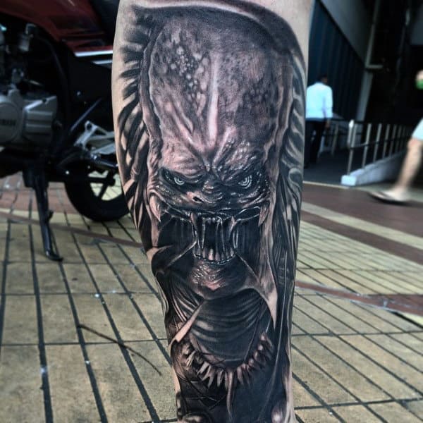 Male With Lower Leg Alien Vs Predator Tattoo