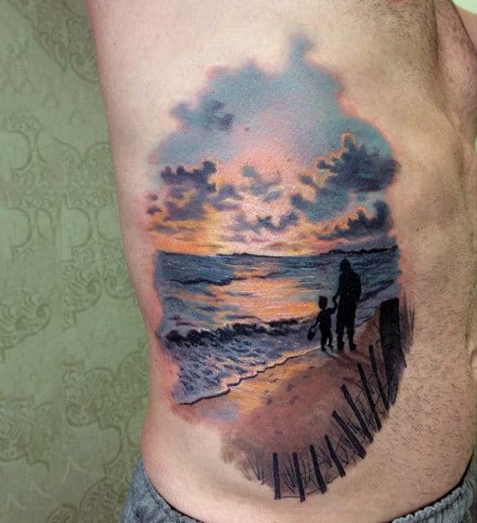 Male With Man And Boy At Beach Sunset Tattoo On Side