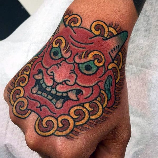 Male With Old School Japanese Demon Hand Tattoo