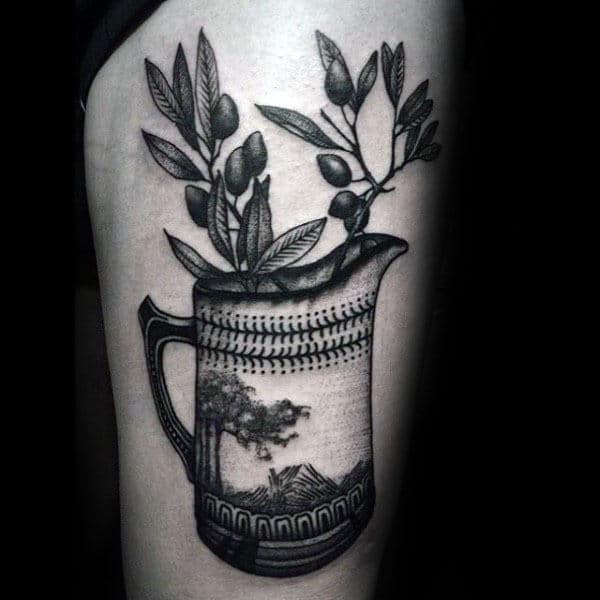 Male With Olive Branch Mug Tattoo On Thigh