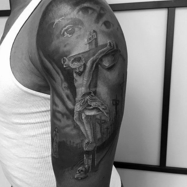 Male With Optical Illusion Jesus Cross And Face Arm Tattoo