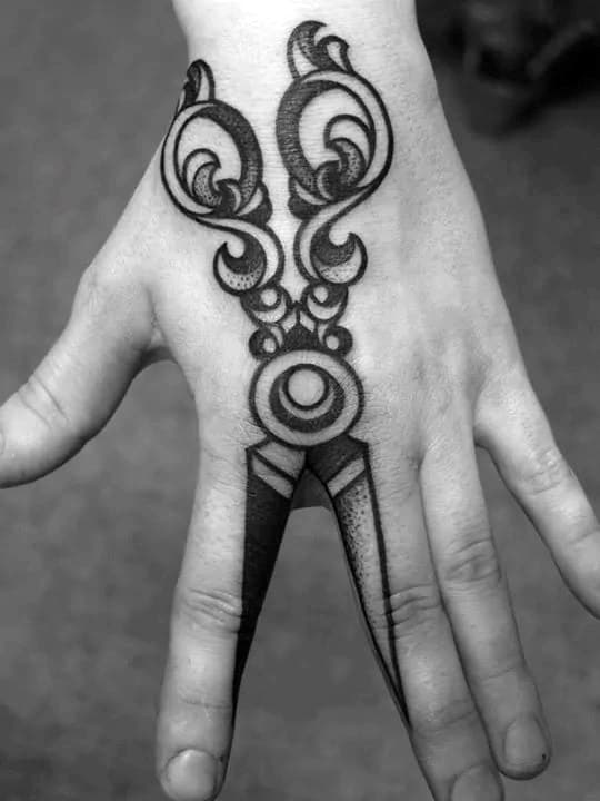 Male With Optical Illusion Scissor Tattoo On Fingers And Hand
