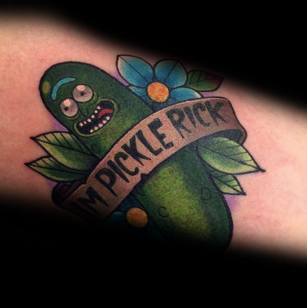 Pickle Rick tattoo with a classic banner reading 'I'm Pickle Rick,' surrounded by vibrant flowers and leaves, featuring bold shading.