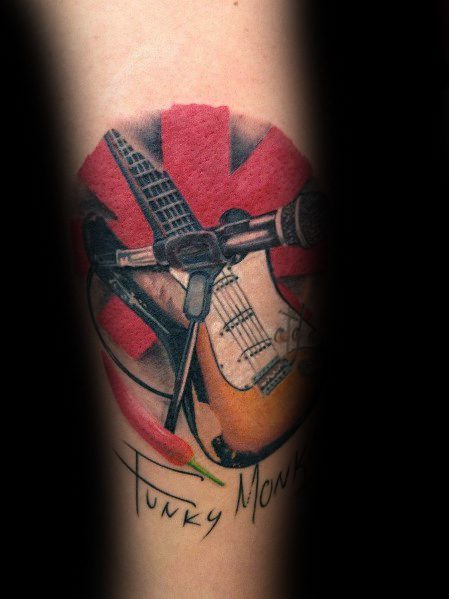 Tattoo featuring the Red Hot Chili Peppers logo with a detailed electric guitar, microphone, and chili pepper, accented by "Funky Monks" script.