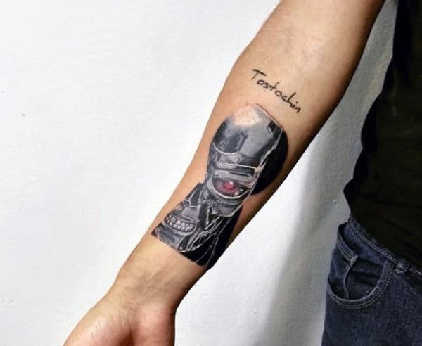 Male With Small Terminator Inner Forearm Tattoo