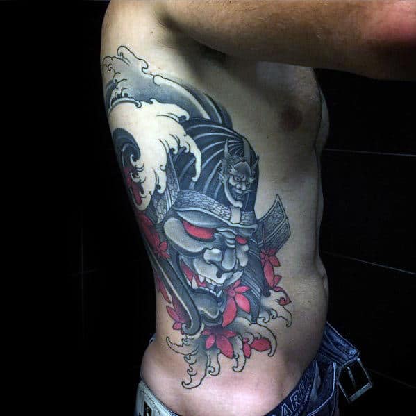 Male With Sweet Tattoo Of Japnese Samuari And Water Waves On Rib Cage Side Of Body
