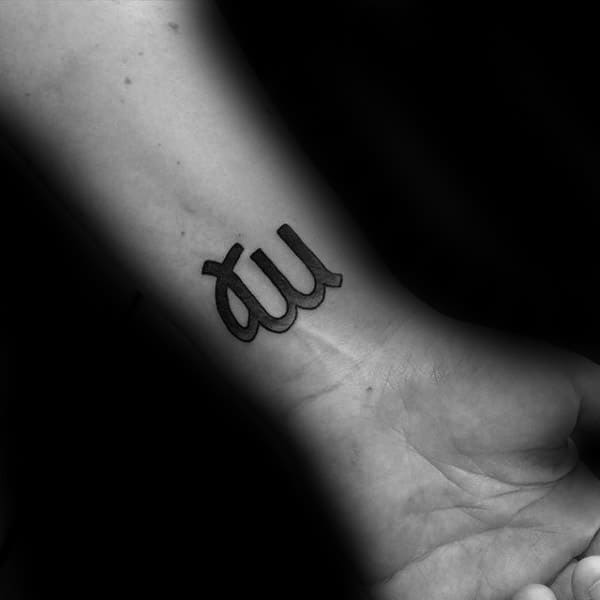 Male With Tattoo Of Astrological Virgo Sign On Wrist