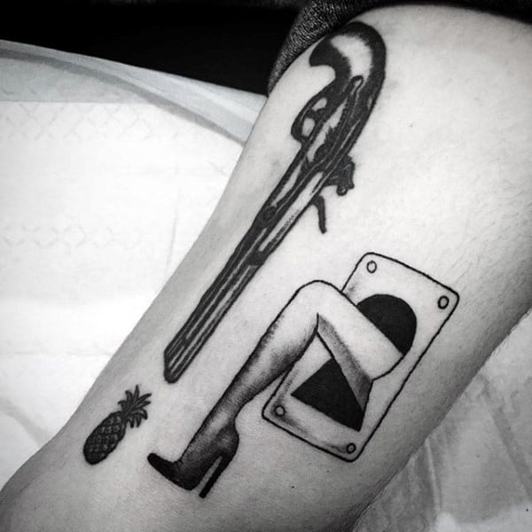 Male With Tattoo Of Leg Sticking Out Of Keyhole On Arm