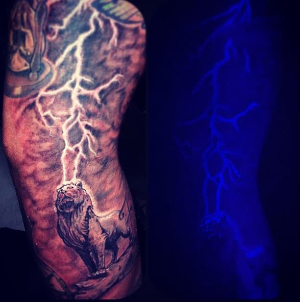 Male With Tattoo Of Lion And Thunder Black Light Ink Ideas