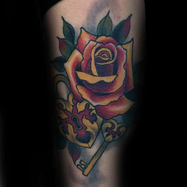 Male With Tattoo Of Lock And Rose Flower On Arm