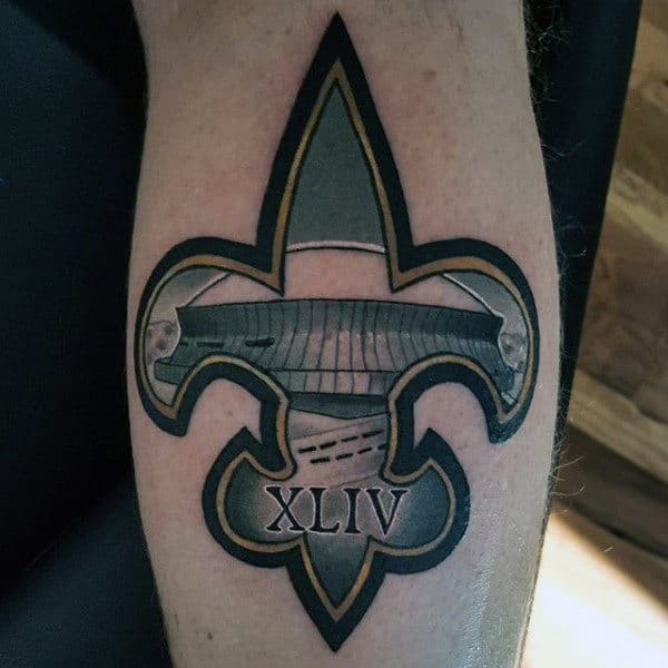 Male With Tattoo Of New Orleans Saints Logo On Arm