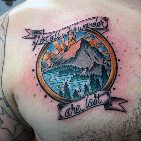 Male With Tattoos Representing Travel On Back Not All Who Wander Are Lost