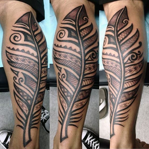 Male With Traditional Feather Design Tattoo On Legs