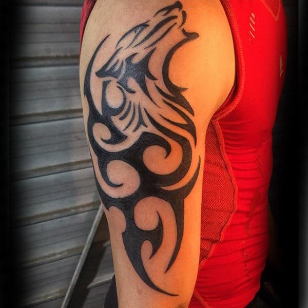 Male With Tribal Wolf Tattoo On Arm