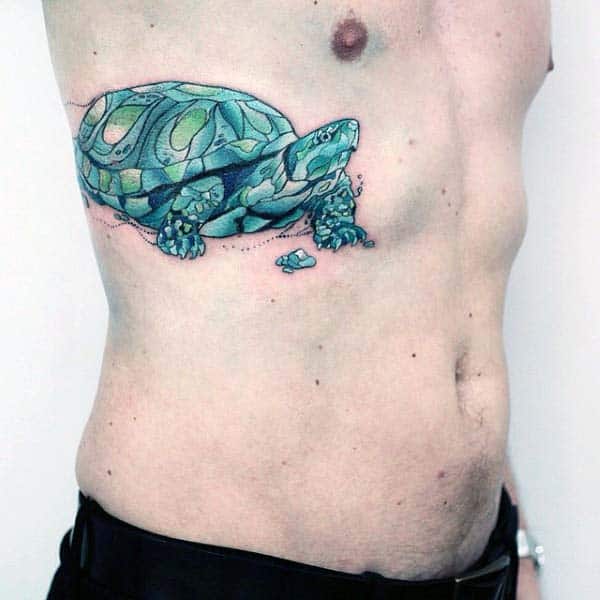 Male With Turtle Watercolor Tattoo On Rib Cage Side Of Body
