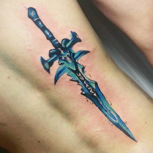 Vibrant tattoo of Frostmourne from World of Warcraft, featuring icy blue tones, glowing runes, and sharp details, inked on the ribcage.