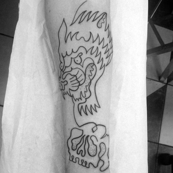 Black and white line tattoo of a wolf and skull on arm