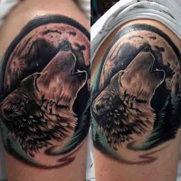 Male Wolf Howling At Moon Tattoo On Upper Arm
