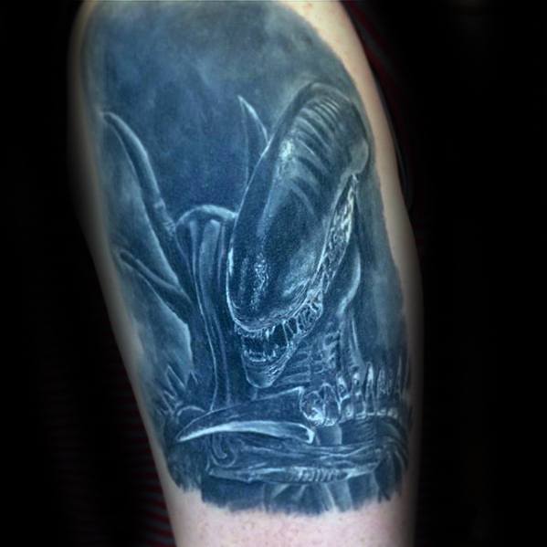 Monochrome Xenomorph tattoo with a misty, atmospheric effect showing the creature’s menacing pose and sharp skeletal details.