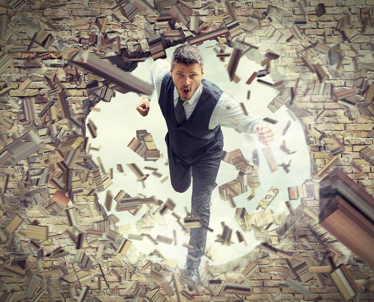 man Running and Breaking Wall